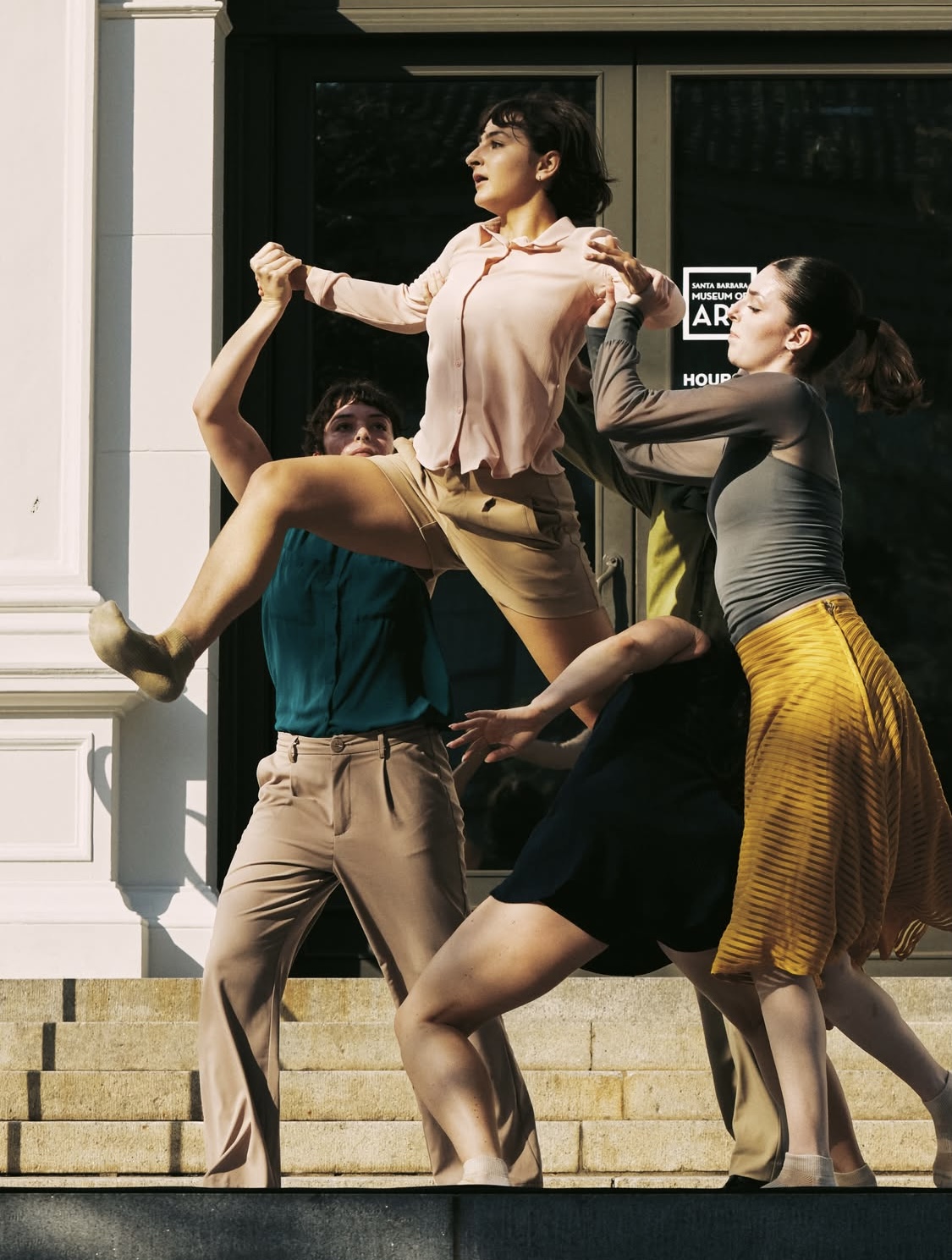 two dancers lifting one dancer